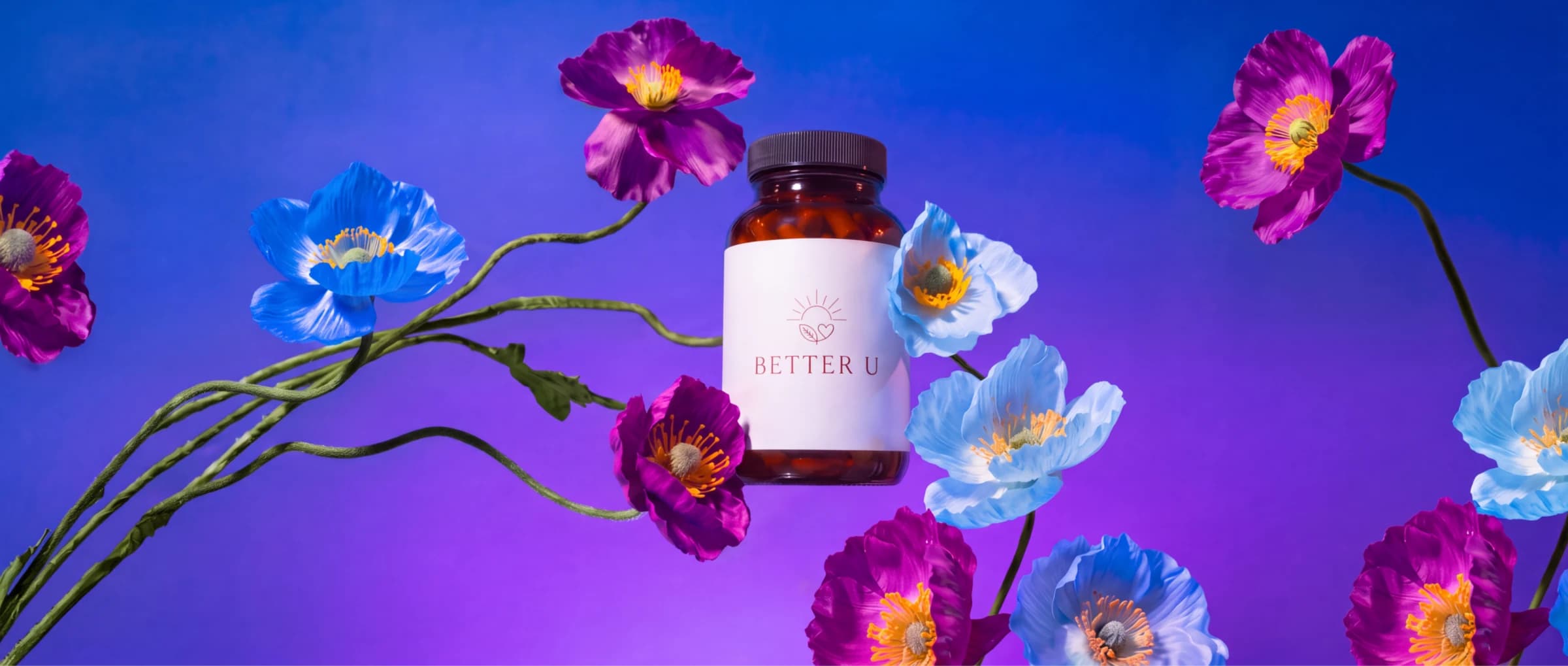 A Better U supplement bottle among blue and purple poppies